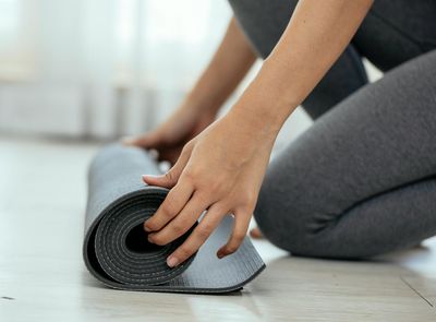 A serene outdoor setting with a yoga mat ready for practice.